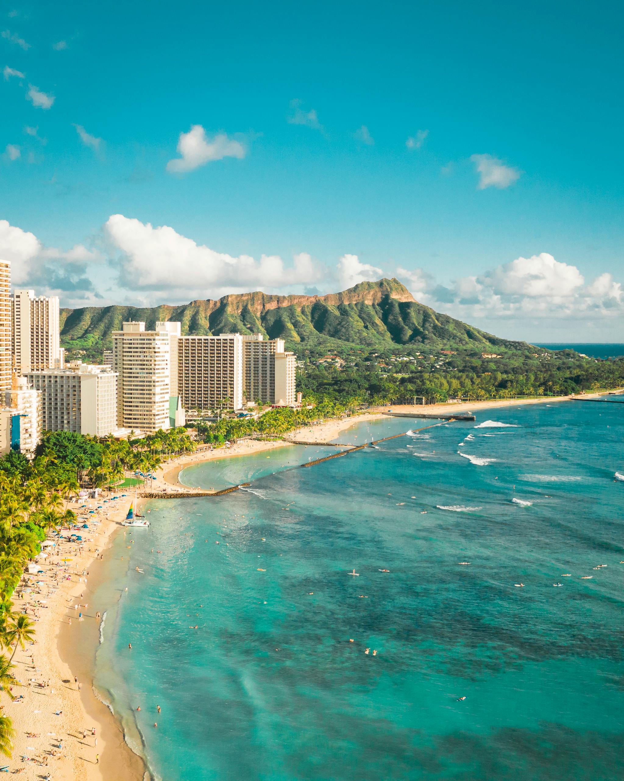 Stunning aerial view of Waikiki Beach, Honolulu with Diamond Head in the background, perfect ocean scenery.