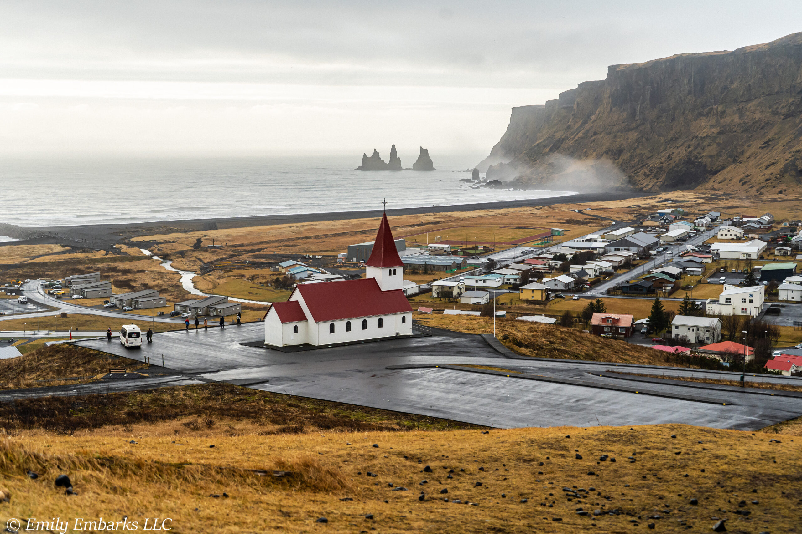 Iconic church and black sand beach in Vik, Iceland